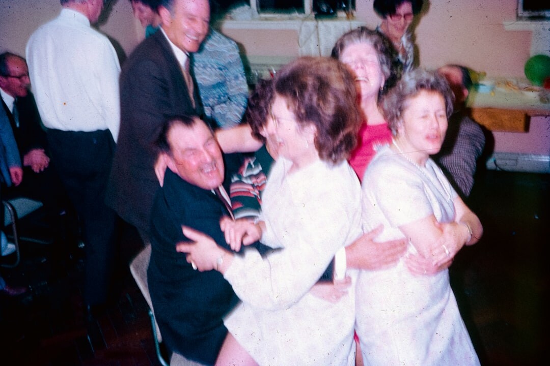 elderly people dancing together
