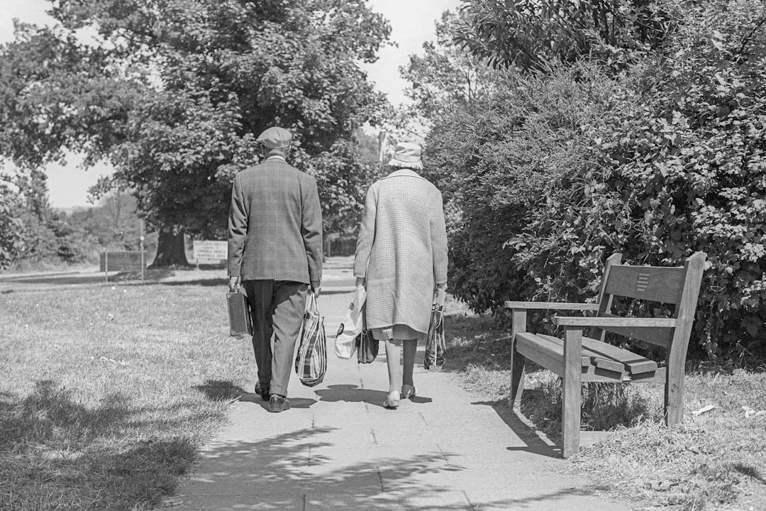 senior couple walking in park