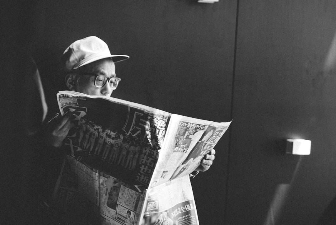 senior reading newspaper